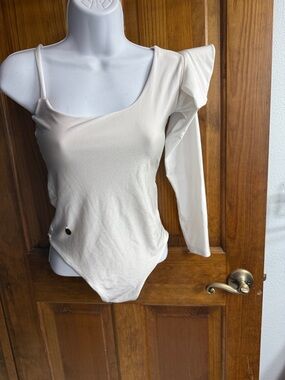 One-Shoulder Cream Bodysuit with Long Sleeve and Ruffle Detail